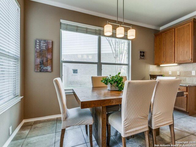 2115 Encino Breeze, San Antonio, TX 78259 - dining room featuring healthy amount of natural light, crown molding, and light tile patterned floors