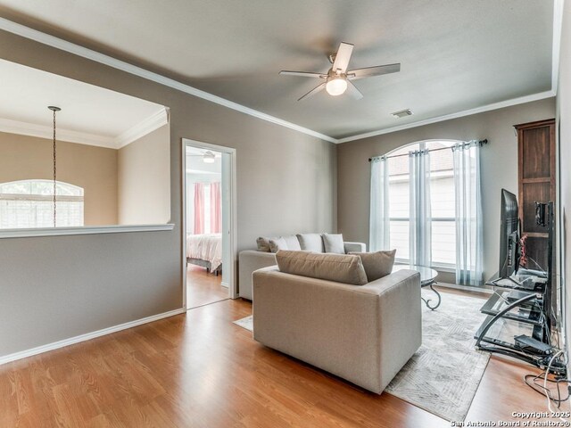 2115 Encino Breeze, San Antonio, TX 78259 - living area featuring a ceiling fan, wood finished floors, and ornamental molding