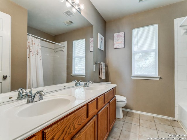 2115 Encino Breeze, San Antonio, TX 78259 - full bathroom with double vanity, plenty of natural light, tile patterned flooring, and shower / bath combo