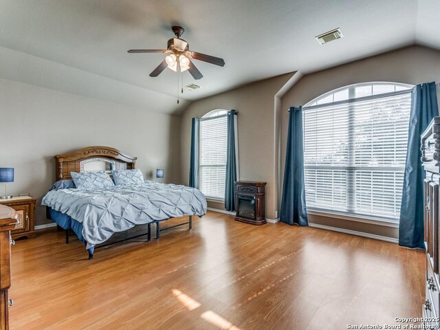 2115 Encino Breeze, San Antonio, TX 78259 - bedroom with lofted ceiling, multiple windows, light wood finished floors, and ceiling fan