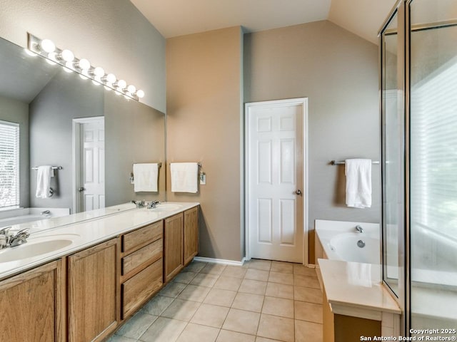 2115 Encino Breeze, San Antonio, TX 78259 - bathroom with a garden tub, double vanity, vaulted ceiling, tile patterned flooring, and an enclosed shower