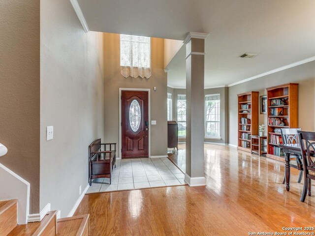 2115 Encino Breeze, San Antonio, TX 78259 - entryway featuring wood finished floors, ornamental molding, and stairs