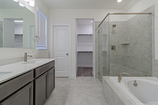 12455 Diagon Aly, San Antonio, TX 78254 - full bath with a garden tub, a shower stall, a walk in closet, double vanity, and tile patterned flooring