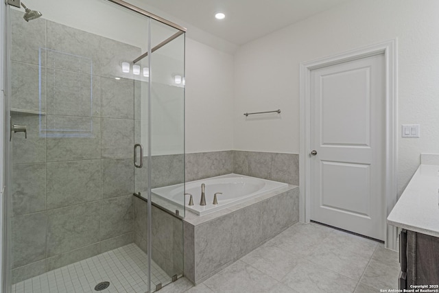 12455 Diagon Aly, San Antonio, TX 78254 - full bath with vanity, a bath, a stall shower, tile patterned floors, and recessed lighting