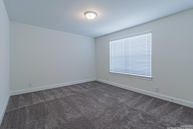 12455 Diagon Aly, San Antonio, TX 78254 - unfurnished room featuring dark colored carpet and baseboards