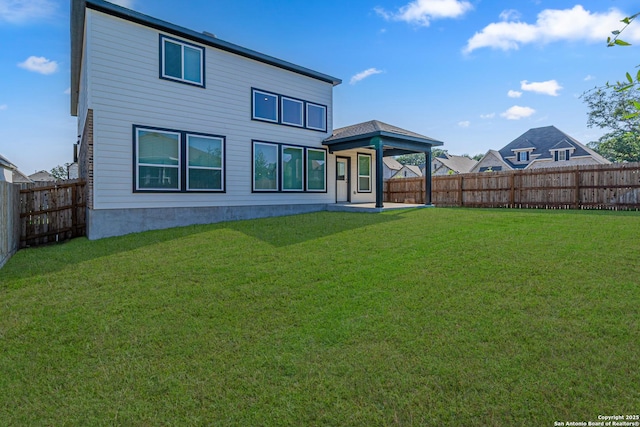 12455 Diagon Aly, San Antonio, TX 78254 - rear view of house with a fenced backyard and a patio