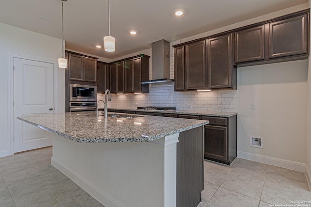 12455 Diagon Aly, San Antonio, TX 78254 - kitchen with wall chimney exhaust hood, stainless steel appliances, light tile patterned floors, light stone counters, and tasteful backsplash