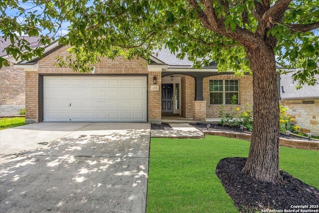 1219 Alpine Pond, San Antonio, TX 78260 - view of front of property with a front yard, an attached garage, driveway, and brick siding