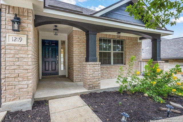 1219 Alpine Pond, San Antonio, TX 78260 - entrance to property with a porch, brick siding, and roof with shingles