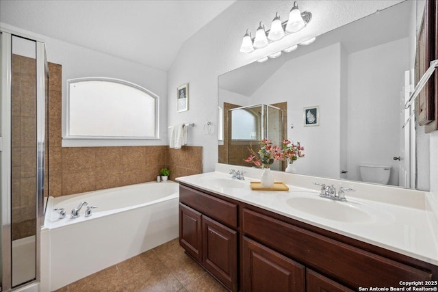 1219 Alpine Pond, San Antonio, TX 78260 - bathroom with vaulted ceiling, a bath, a shower stall, double vanity, and tile patterned floors