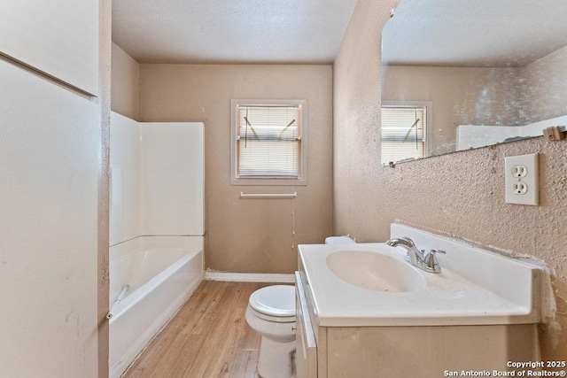 518 Wright Ave, Schertz, TX 78154 - full bathroom featuring wood finished floors, vanity, and tub / shower combination