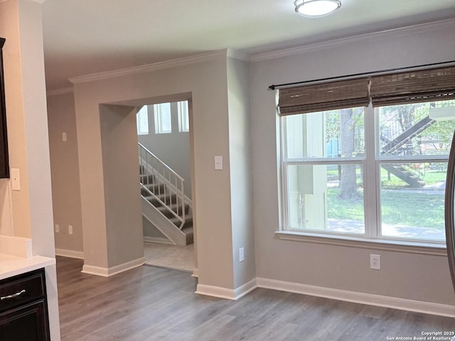 100 Lorenz Rd Unit 803, San Antonio, TX 78209 - empty room featuring healthy amount of natural light, light wood-style floors, ornamental molding, and stairs