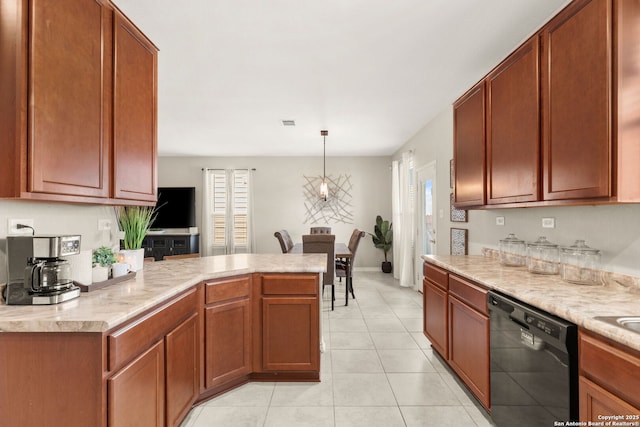2059 Wind Chime, New Braunfels, TX 78130 - kitchen with black dishwasher, a peninsula, light tile patterned floors, and decorative light fixtures