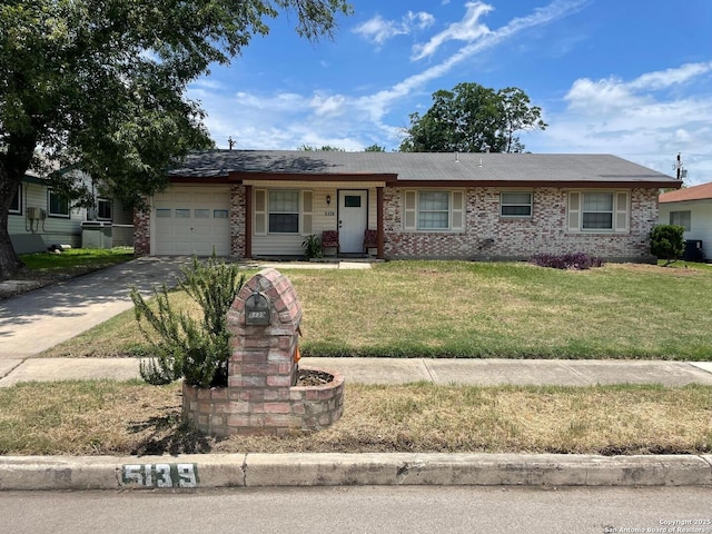 5139 Village Ct, San Antonio, TX 78218 - ranch-style home with a garage, concrete driveway, a front lawn, and brick siding