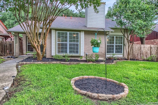 4326 Hilton Head, San Antonio, TX 78217 - rear view of house with brick siding, roof with shingles, and a chimney