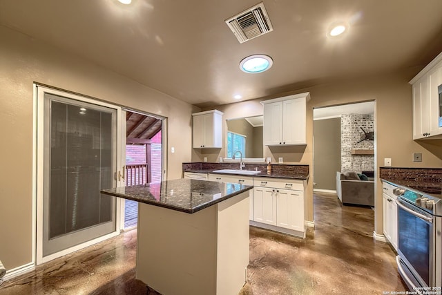 4326 Hilton Head, San Antonio, TX 78217 - kitchen with stainless steel electric range, finished concrete floors, white cabinets, and recessed lighting