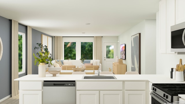 3709 Swift Fox Rd, New Braunfels, TX 78130 - kitchen with dishwasher, white microwave, white cabinets, and open floor plan