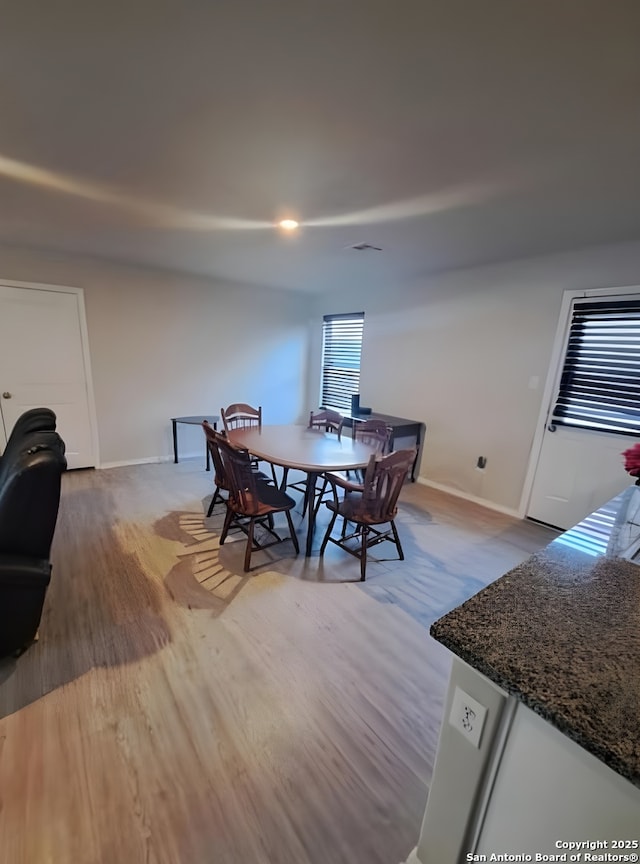 318 Pradera Cv, San Antonio, TX 78237 - dining area featuring wood finished floors and baseboards