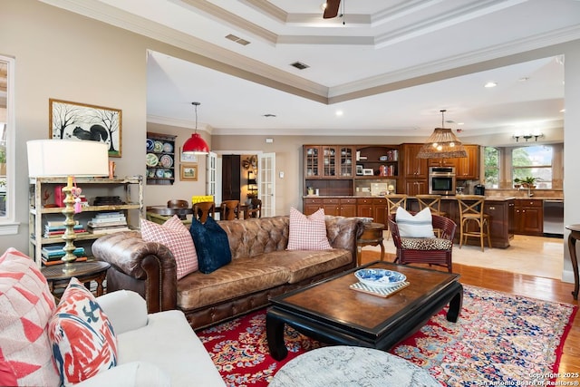 5 Remington, San Antonio, TX 78258 - living area featuring ornamental molding, a tray ceiling, light wood-type flooring, recessed lighting, and ceiling fan