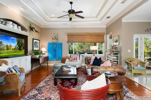 5 Remington, San Antonio, TX 78258 - living room with healthy amount of natural light, wood finished floors, a tray ceiling, and ornamental molding
