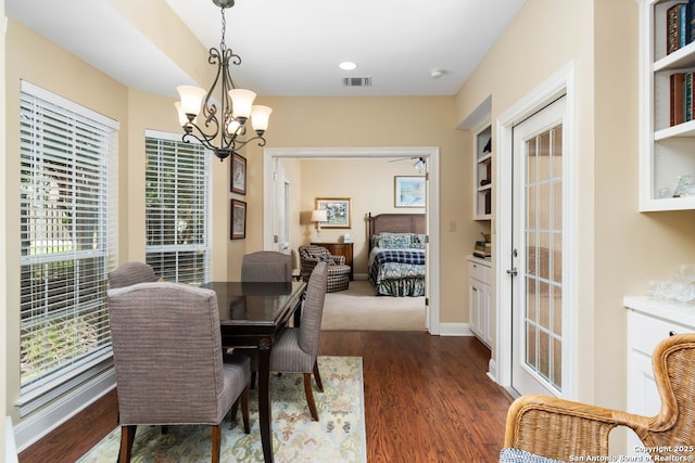 5 Remington, San Antonio, TX 78258 - dining space with a chandelier and dark wood-type flooring