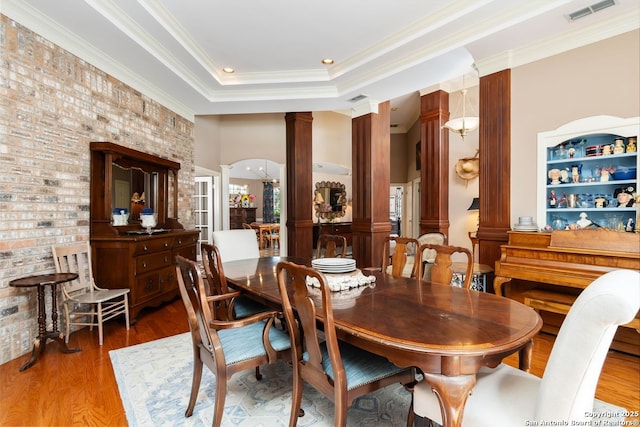 5 Remington, San Antonio, TX 78258 - dining room with ornate columns, wood finished floors, crown molding, and a raised ceiling