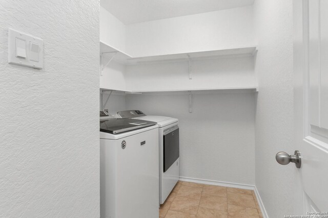 15102 Field Sparrow, San Antonio, TX 78253 - laundry room with washing machine and clothes dryer and a textured wall