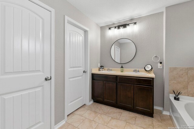 15102 Field Sparrow, San Antonio, TX 78253 - full bathroom with double vanity, a garden tub, and tile patterned floors