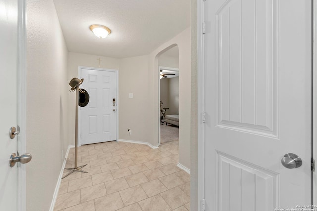 15102 Field Sparrow, San Antonio, TX 78253 - entrance foyer featuring arched walkways, light tile patterned floors, and a textured ceiling