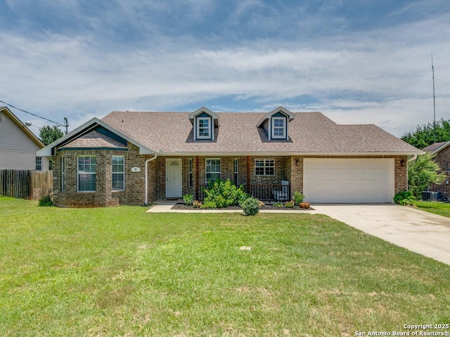 97 Windcrest, Floresville, TX 78114 - cape cod home featuring concrete driveway, brick siding, an attached garage, and roof with shingles