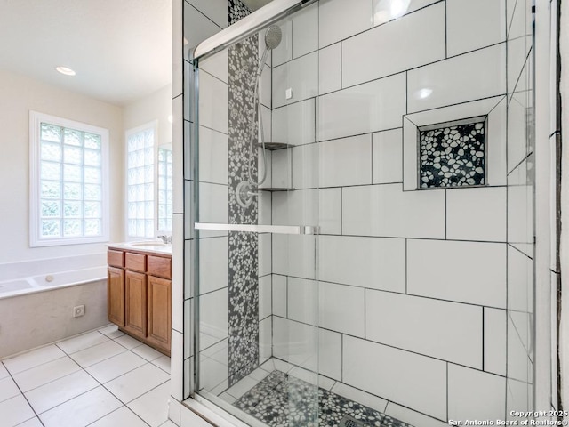 97 Windcrest, Floresville, TX 78114 - bathroom with a shower stall, a garden tub, vanity, tile patterned floors, and recessed lighting