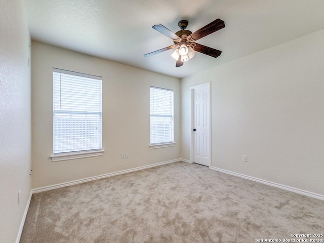 97 Windcrest, Floresville, TX 78114 - empty room with carpet flooring and a ceiling fan