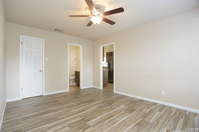 8226 Creekline Dr, San Antonio, TX 78251 - unfurnished bedroom with light wood finished floors, ensuite bath, built in refrigerator, and a ceiling fan