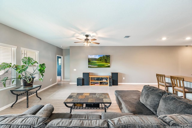 13215 Turnesa Ter, San Antonio, TX 78221 - living area featuring ceiling fan, wood finished floors, and recessed lighting