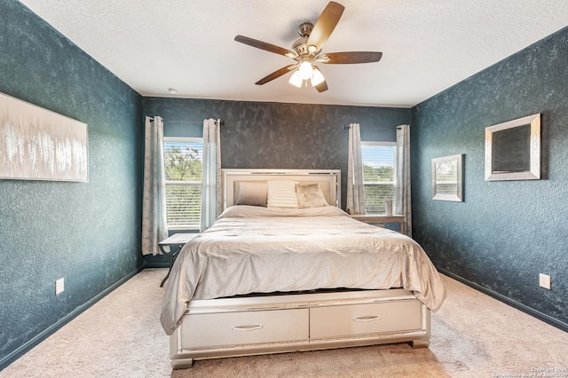 13215 Turnesa Ter, San Antonio, TX 78221 - carpeted bedroom with a textured ceiling, a textured wall, and a ceiling fan