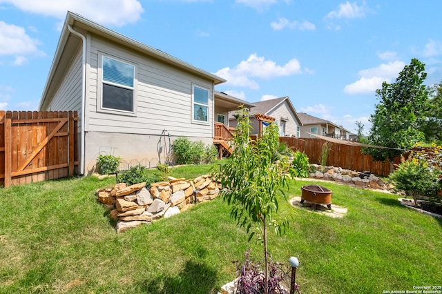 13215 Turnesa Ter, San Antonio, TX 78221 - view of yard featuring an outdoor fire pit