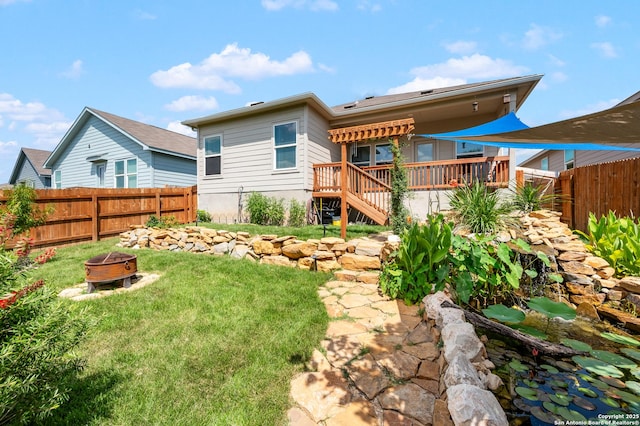 13215 Turnesa Ter, San Antonio, TX 78221 - back of property featuring a fire pit, a fenced backyard, and a deck