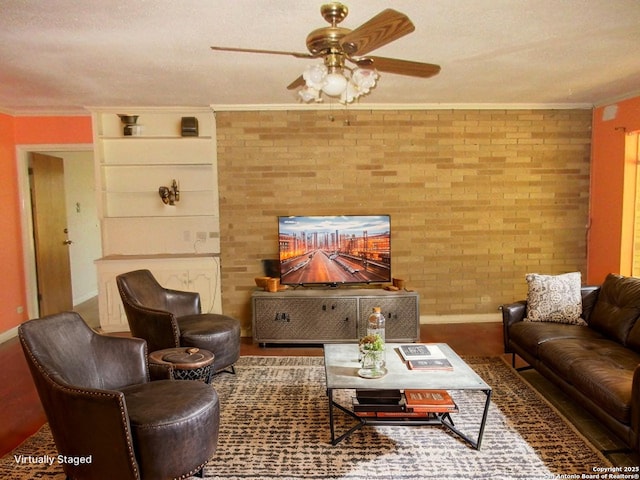 2310 W Gramercy, San Antonio, TX 78201 - living room with ceiling fan, crown molding, and brick wall