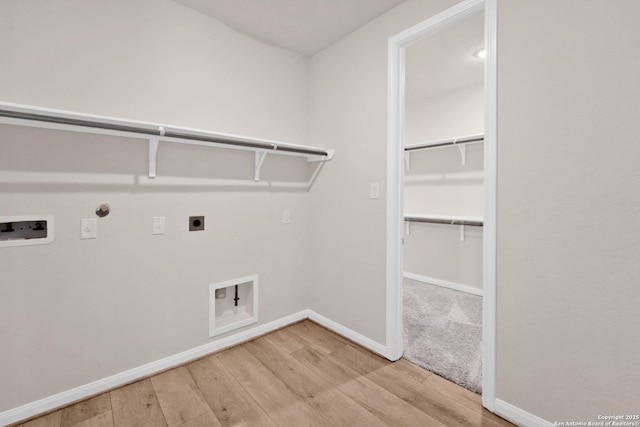 2614 Banditos Rdg, San Antonio, TX 78245 - laundry area with hookup for an electric dryer, wood finished floors, hookup for a gas dryer, and hookup for a washing machine
