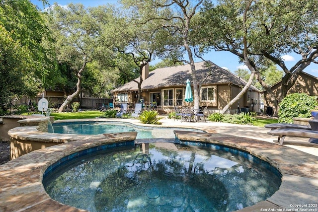26815 Duet Dr, San Antonio, TX 78260 - view of swimming pool featuring a fenced backyard, a pool with connected hot tub, and a patio