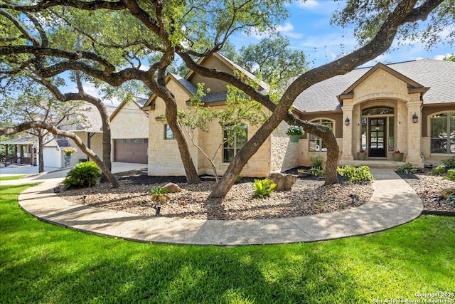 26815 Duet Dr, San Antonio, TX 78260 - french country style house featuring a garage, stone siding, and roof with shingles