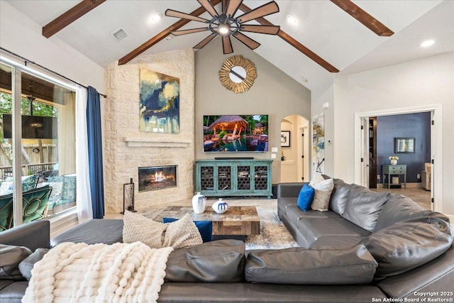 26815 Duet Dr, San Antonio, TX 78260 - living room with a ceiling fan, a stone fireplace, high vaulted ceiling, arched walkways, and plenty of natural light