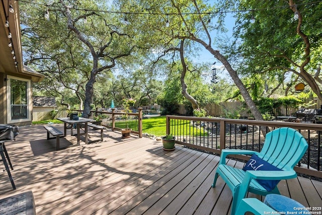 26815 Duet Dr, San Antonio, TX 78260 - wooden deck with outdoor dining area and a fenced backyard