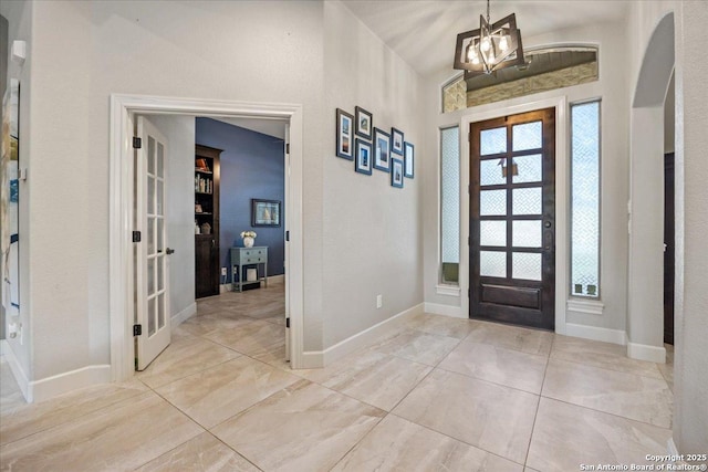 26815 Duet Dr, San Antonio, TX 78260 - entrance foyer with a chandelier, french doors, and arched walkways