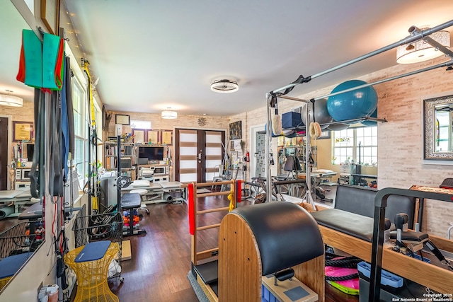 9518 Wahada, San Antonio, TX 78217 - exercise room featuring wood finished floors and brick wall