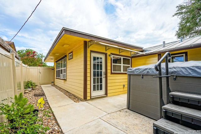 9518 Wahada, San Antonio, TX 78217 - view of side of home featuring a fenced backyard, a patio, a hot tub, and a gate