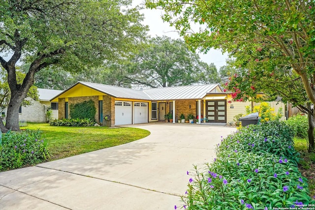 9518 Wahada, San Antonio, TX 78217 - mid-century home with an attached garage, a front yard, a standing seam roof, and brick siding