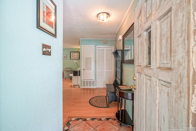 9518 Wahada, San Antonio, TX 78217 - hall featuring a textured ceiling and tile patterned floors