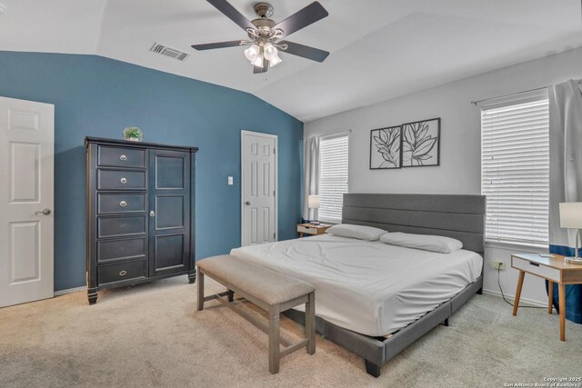 9427 Hacienda Acres, San Antonio, TX 78245 - bedroom with lofted ceiling, light colored carpet, and ceiling fan