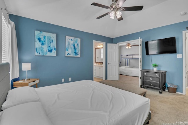 9427 Hacienda Acres, San Antonio, TX 78245 - carpeted bedroom featuring ensuite bath, a ceiling fan, and lofted ceiling